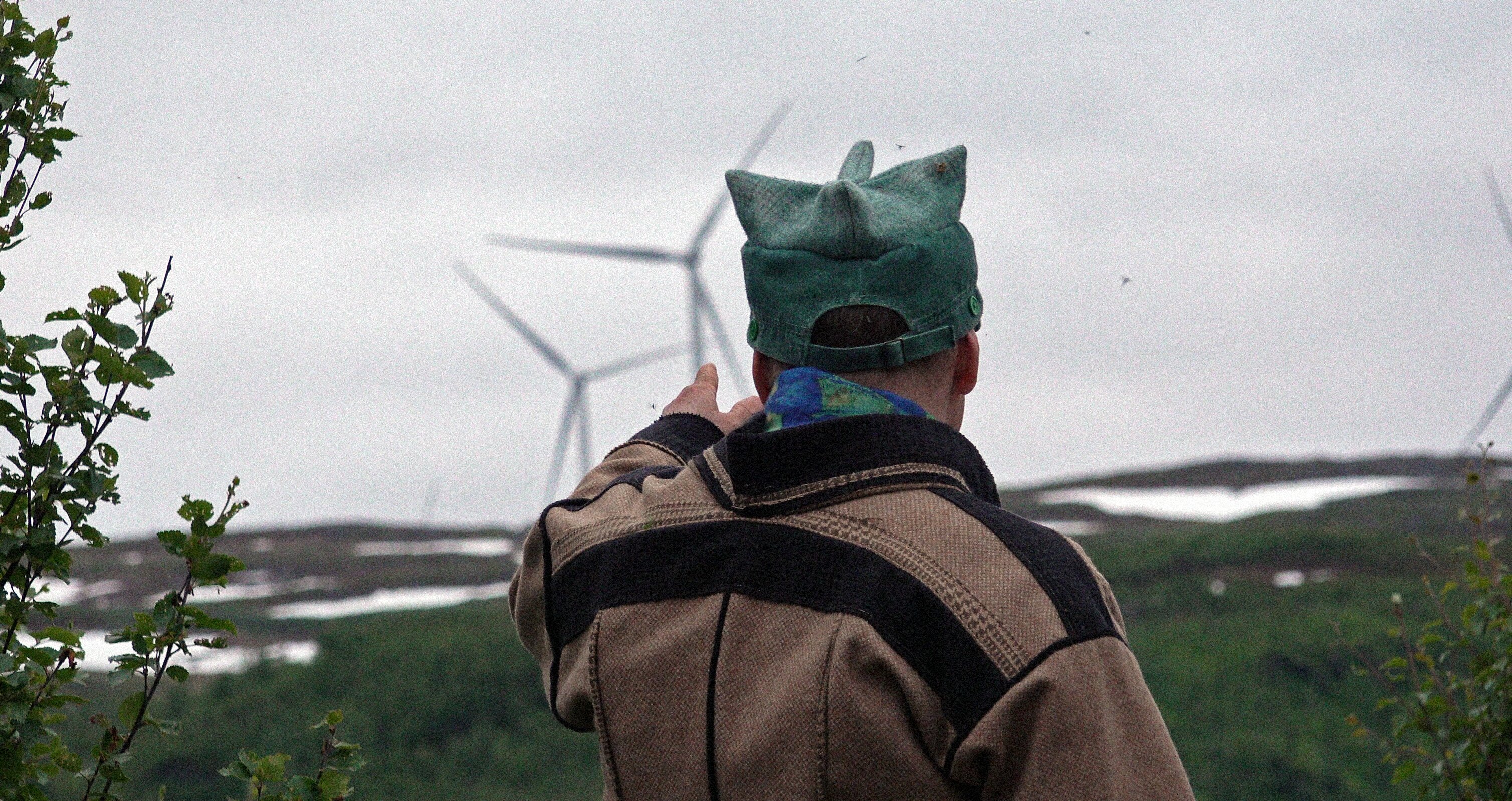 Ánde Somby yoiking with the wind at a wind farm